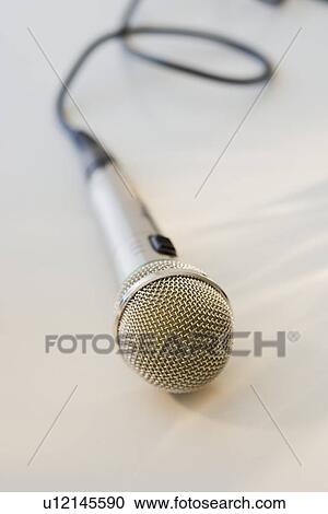 Stock Image - Close up of microphone. Fotosearch