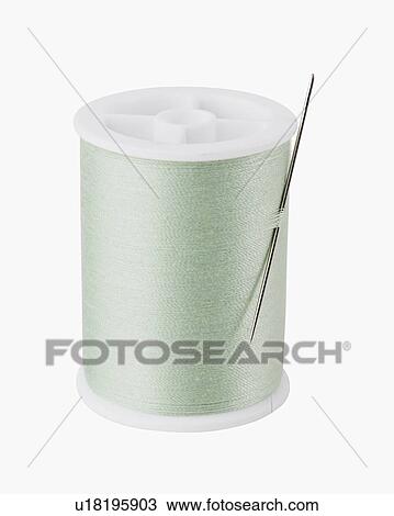 Close up of needle on spool of thread View Large Photo Image Stock Image - Close up of needle on spool of thread. Fotosearch