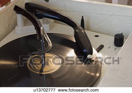 Stock Photo - Close up of old fashioned record player. Fotosearch