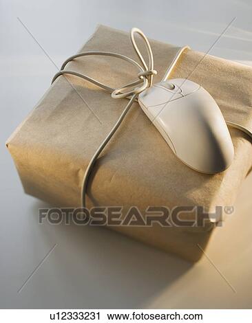 Close up of package and computer mouse View Large Photo Image Stock Image - Close up of package and computer mouse. Fotosearch