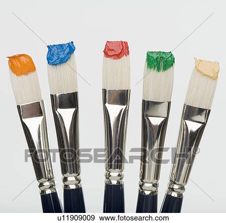 Stock Photo - Close up of paint brushes with paint on bristles. Fotosearch