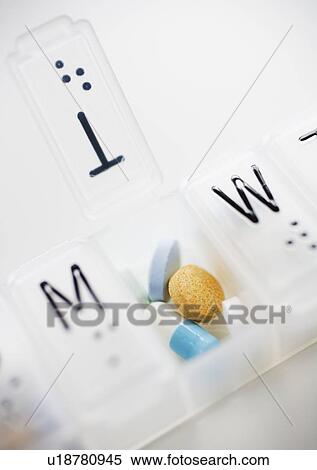 Close up of pills in weekly organizer View Large Photo Image Stock Photography - Close up of pills in weekly organizer. Fotosearch