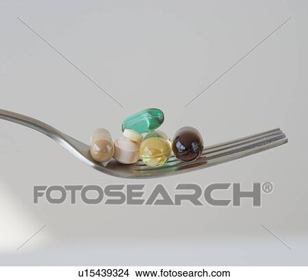 Close up of pills on fork View Large Photo Image Picture - Close up of pills on fork. Fotosearch