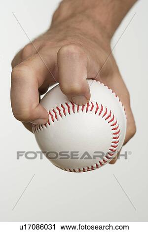 Close up of pitcher holding baseball View Large Photo Image Stock Image - Close up of pitcher holding baseball. Fotosearch