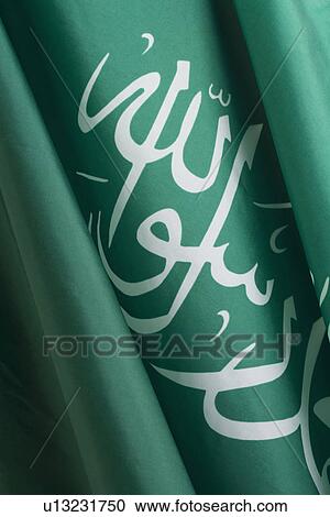 Stock Image - Close up of Saudi Arabian flag. Fotosearch