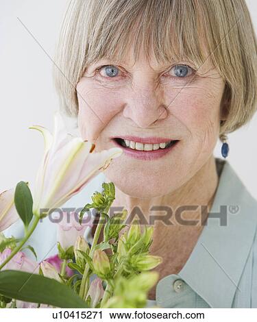 Close up of senior woman and flowers View Large Photo Image Stock Image - Close up of senior woman and flowers. Fotosearch