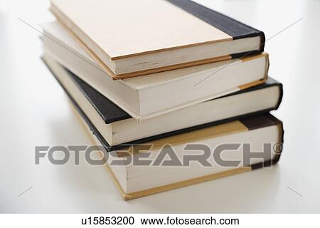 Stock Image - Close up of stack of books. Fotosearch