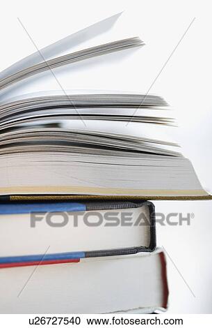 Stock Image - Close up of stack of books. Fotosearch