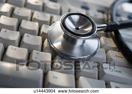 Close up of stethoscope on computer keyboard View Large Photo Image Picture - Close up of stethoscope on computer keyboard. Fotosearch