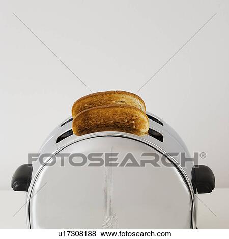 Close up of toast in toaster View Large Photo Image Stock Photo - Close up of toast in toaster. Fotosearch