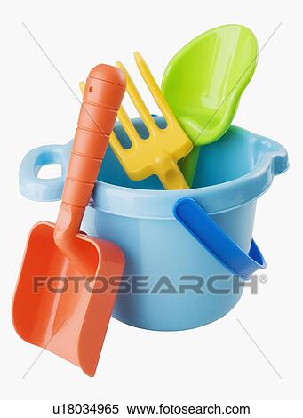 Stock Photography - Close up of toy pail and shovels. Fotosearch