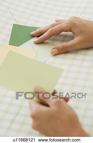 Close up of woman comparing paint swatches View Large Photo Image Stock Image - Close up of woman comparing paint swatches. Fotosearch