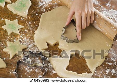 Close up of woman cutting out cookies View Large Photo Image Stock Image - Close up of woman cutting out cookies. Fotosearch