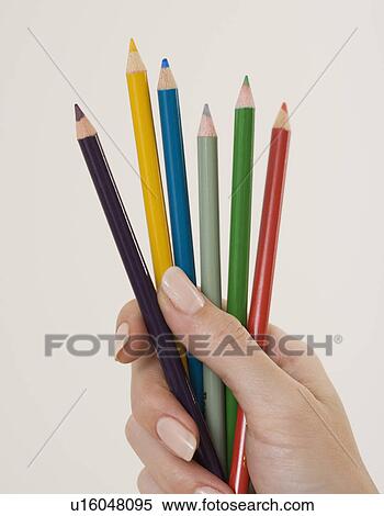 Close up of woman holding colored pencils View Large Photo Image Stock Photography - Close up of woman holding colored pencils. Fotosearch