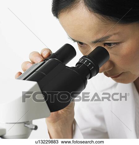 Close up of woman looking in microscope View Large Photo Image Stock Image - Close up of woman looking in microscope. Fotosearch