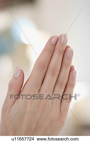 Close up of woman praying View Large Photo Image Picture - Close up of woman praying. Fotosearch