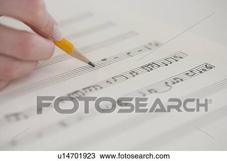 Close up of woman writing music View Large Photo Image Stock Image - Close up of woman writing music. Fotosearch