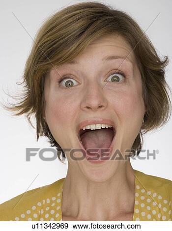 Stock Photo - Close up of woman yelling. Fotosearch