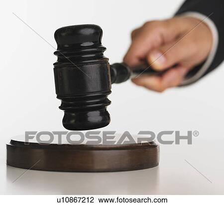 Close up studio shot of judge's hand with gavel View Large Photo Image Stock Image - Close up studio shot of judge's hand with gavel. Fotosearch