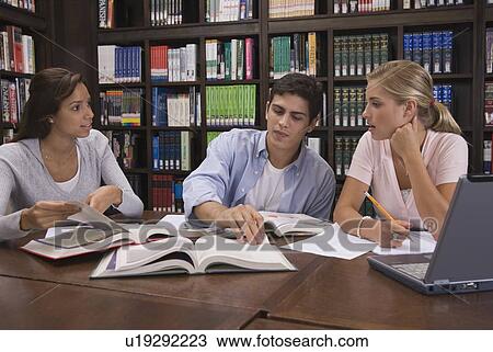 College students studying in library View Large Photo Image Stock Image - College students studying in library. Fotosearch