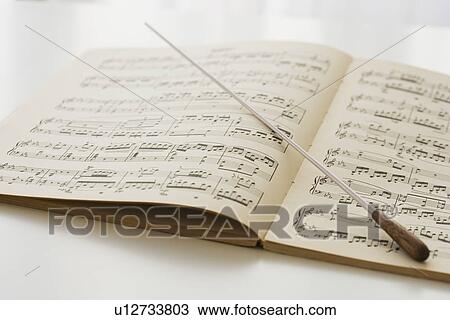 Conductor’s baton on sheet music View Large Photo Image Stock Image - Conductor’s baton on sheet music. Fotosearch