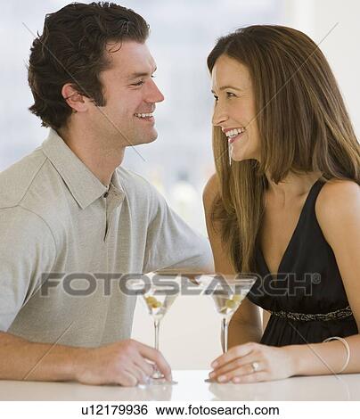 Couple drinking martinis View Large Photo Image Stock Photograph - Couple drinking martinis. Fotosearch