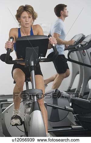 Couple exercising at gym View Large Photo Image Stock Photo - Couple exercising at gym. Fotosearch