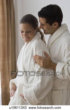 Couple in bathrobes hugging View Large Photo Image Stock Image - Couple in bathrobes hugging. Fotosearch