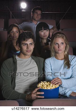 Stock Photo - Couple in movie theater. Fotosearch