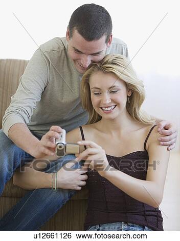 Stock Photograph - Couple looking at video camera. Fotosearch