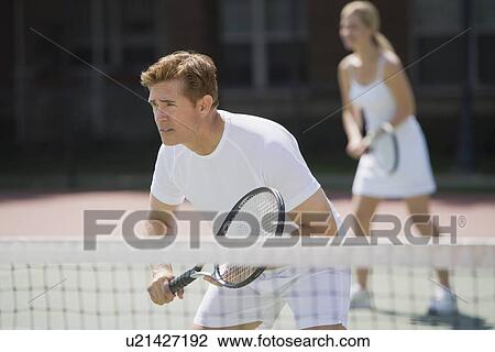Couple playing tennis View Large Photo Image Stock Image - Couple playing tennis. Fotosearch