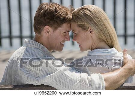 Stock Image - Couple smiling at each other. Fotosearch