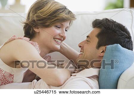 Stock Photography - Couple smiling at each other. Fotosearch