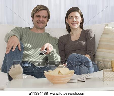 Couple watching television View Large Photo Image Stock Photo - Couple watching television. Fotosearch