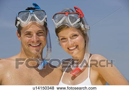 Couple wearing snorkeling gear View Large Photo Image Stock Photo - Couple wearing snorkeling gear. Fotosearch