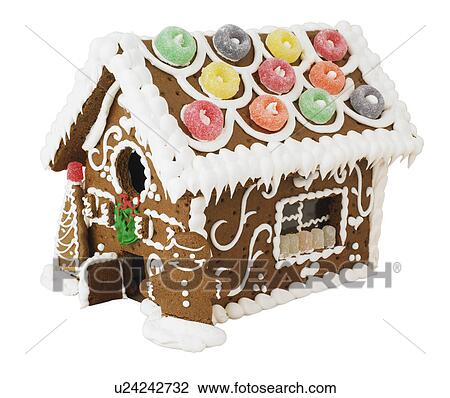Stock Image - Decorated gingerbread house. Fotosearch