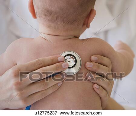 Doctor listening to baby’s lungs View Large Photo Image Stock Photo - Doctor listening to baby’s lungs. Fotosearch
