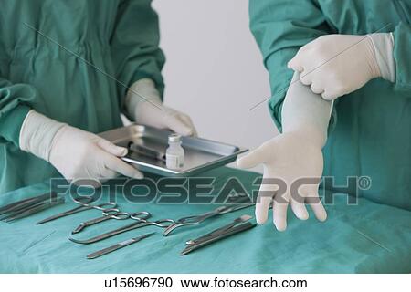 Doctors preparing for surgery View Large Photo Image Stock Image - Doctors preparing for surgery. Fotosearch