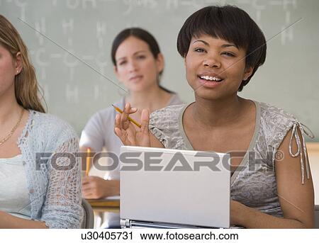 Stock Image - Ethnic-ethnic women in classroom. Fotosearch
