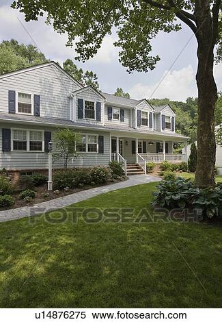 Stock Photography - Exterior view of house with tree. Fotosearch