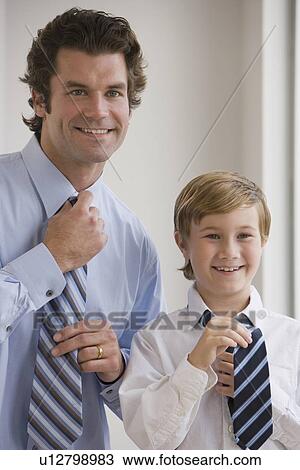 Father and son tying neckties View Large Photo Image Stock Image - Father and son tying neckties. Fotosearch