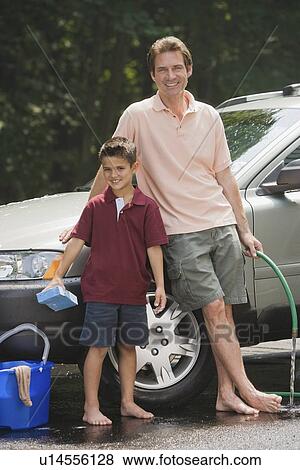 Stock Photo - Father and son washing car. Fotosearch