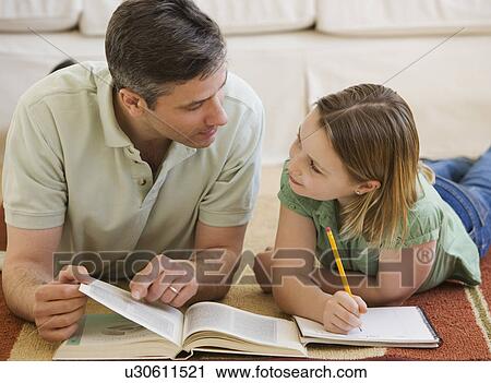 Father helping daughter with homework View Large Photo Image Stock Image - Father helping daughter with homework. Fotosearch