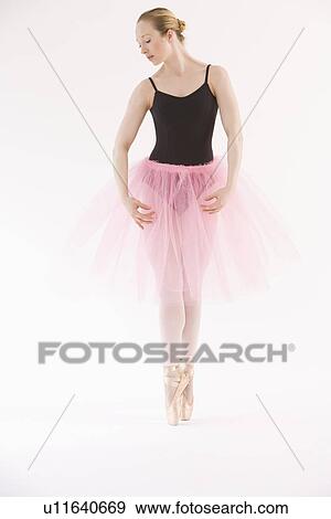 Female ballet dancer dancing on pointe View Large Photo Image Stock Photo - Female ballet dancer dancing on pointe. Fotosearch