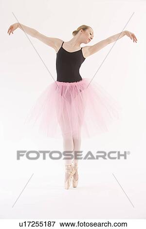 Female ballet dancer dancing on pointe View Large Photo Image Stock Photo - Female ballet dancer dancing on pointe. Fotosearch