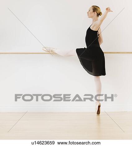 Female ballet dancer in dance studio View Large Photo Image Stock Photo - Female ballet dancer in dance studio. Fotosearch