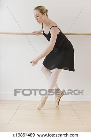 Stock Photo - Female ballet dancer in dance studio. Fotosearch