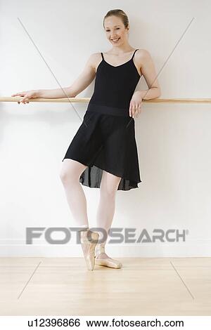Stock Photograph - Female ballet dancer in dance studio. Fotosearch