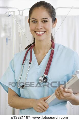 Female doctor holding chart View Large Photo Image Stock Photo - Female doctor holding chart. Fotosearch