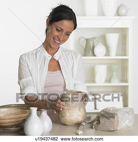 Female potter making jug View Large Photo Image Stock Image - Female potter making jug. Fotosearch